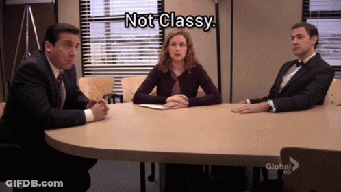 A Group Of People Sitting Around A Table With A Caption That Says " Not Classy " GIF