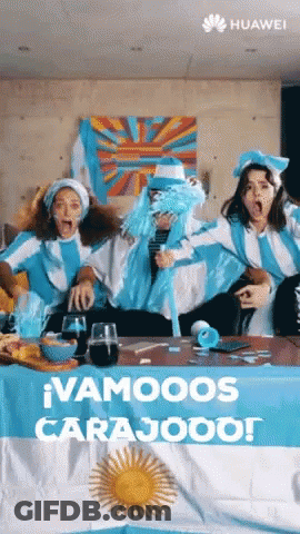 A Group Of People Sitting Around A Table With A Huawei Logo On The Bottom GIF