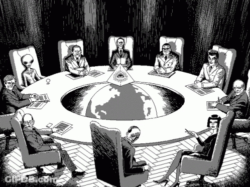 People Sitting Around Table With Pyramid GIF