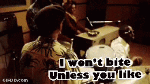 A Group Of People Sitting Around A Table With The Words " I Won T Bite Unless You Like " On The Bottom GIF