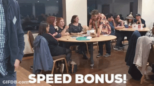 A Group Of People Sitting Around A Table With The Words Speed Bonus Written In White GIF