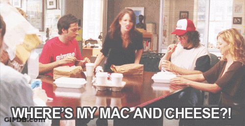 A Group Of People Sitting Around A Table With The Words Where 'S My Mac And Cheese ? GIF