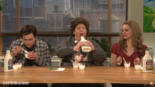 A Group Of People Sitting At A Table With Bottles Of Mayonnaise On It GIF