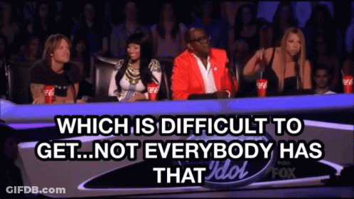 Group Sitting At Table With Difficulties And Idol Text GIF