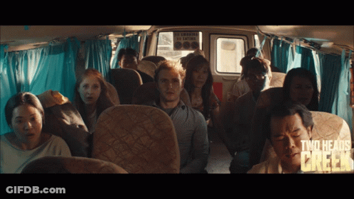 A Group Of People Sitting In A Bus With The Words Two Heads Chicken Written On The Bottom GIF