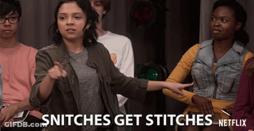 A Group Of People Sitting In A Room With The Words Snitches Get Stitches Netflix GIF