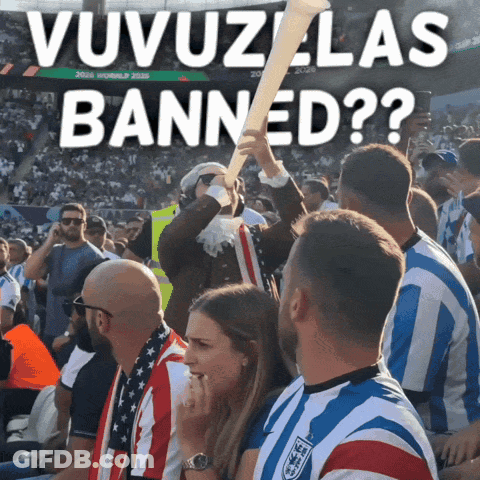 A Group Of People Sitting In A Stadium With A Sign That Says ' Uvuzlas Banned ' GIF