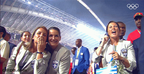 A Group Of People Sitting In A Stadium With The Olympics Logo On The Bottom GIF
