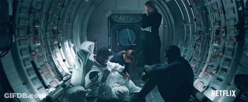 A Group Of People Sitting In A Tunnel With A Netflix Logo On The Bottom GIF