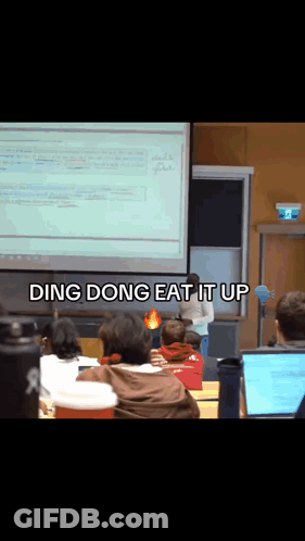 A Group Of People Sitting In Front Of A Projector Screen That Says " Ding Dong Eat It Up " On It GIF