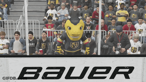 A Group Of People Sitting In Front Of A Sign That Says Bauer On It GIF