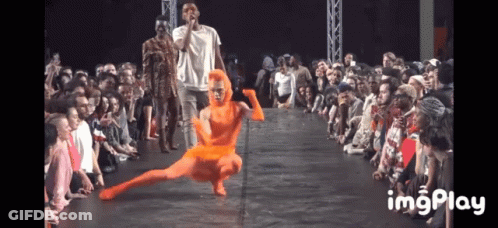 A Group Of People Sitting In Front Of A Stage With The Word Imgplay On The Bottom Right GIF