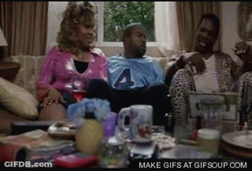 A Group Of People Sitting On A Couch With A Man Wearing A Jersey With The Number 4 On It GIF