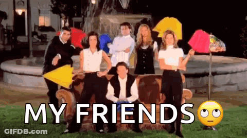 A Group Of People Sitting On A Couch With Umbrellas In Front Of A Fountain With The Words `` My Friends '' . GIF