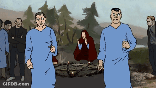 A Group Of People Standing Around A Circle With Candles In It GIF