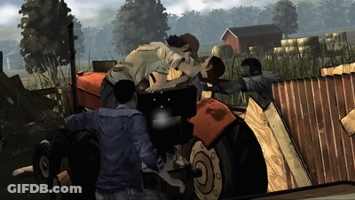 A Group Of People Standing Around A Tractor That Has The Letter O On The Front GIF