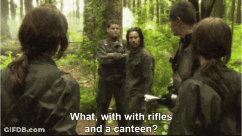 People Standing In Forest With Rifles And Canteen GIF