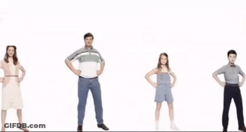 A Group Of People Standing In A Line With Their Hands On Their Hips . GIF