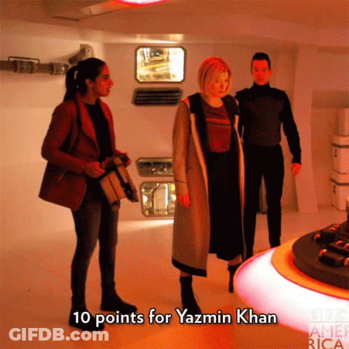 A Group Of People Standing In A Room With The Words " 10 Points For Yazmin Khan " On The Bottom GIF