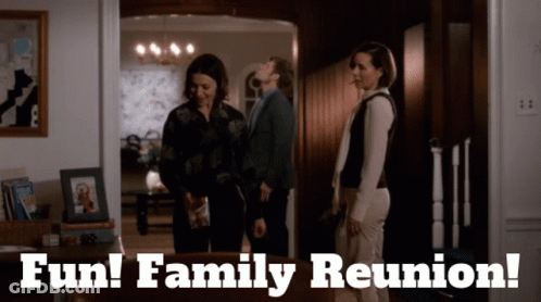 A Group Of People Standing In A Room With The Words Fun Family Reunion GIF