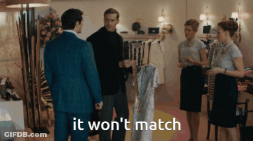 A Group Of People Standing In A Room With The Words " It Won 'T Match " GIF
