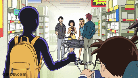 A Group Of People Standing In A Store With A Sign That Says ' I Love ' On It GIF