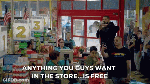 A Group Of People Standing In A Store With The Words Anything You Guys Want In The Store Is Free GIF