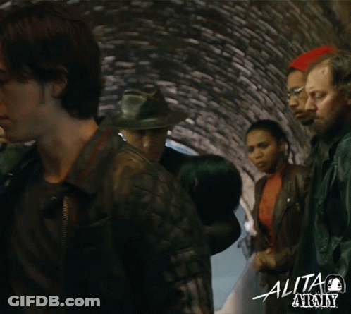 People Standing In Tunnel With Alita GIF
