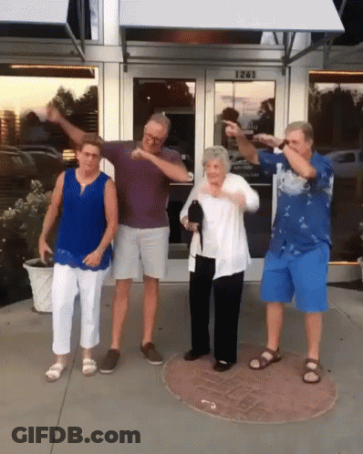 A Group Of People Standing In Front Of A Building With The Number 1261 On The Door GIF
