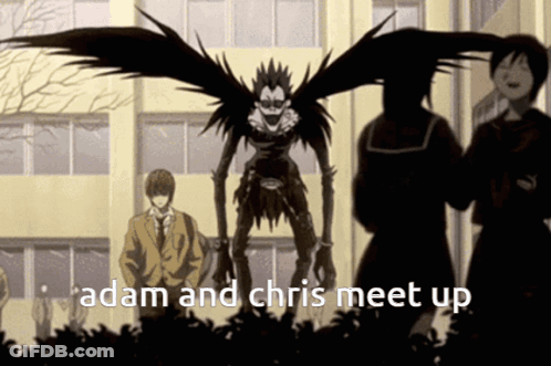A Group Of People Standing In Front Of A Building With The Words " Adam And Chris Meet Up " GIF