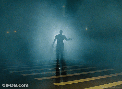 A Group Of People Standing In Front Of A Door That Says Exit On It GIF