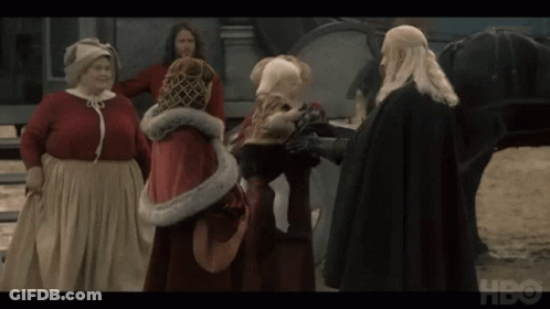 A Group Of People Standing In Front Of A Horse With Hbo Written On The Bottom GIF