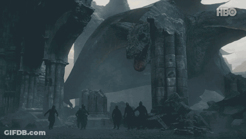 A Group Of People Standing In Front Of A Large Dragon With Hbo Written On The Bottom GIF
