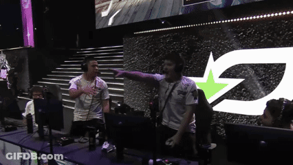 A Group Of People Standing In Front Of A Large Screen With The Letter Z GIF