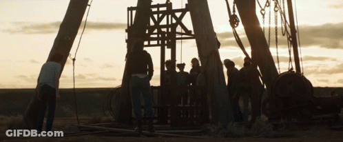 A Group Of People Standing In Front Of A Large Structure That Says ' A ' On It GIF