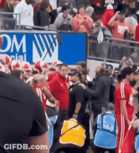 A Group Of People Standing In Front Of A Sign That Says Dm Social GIF