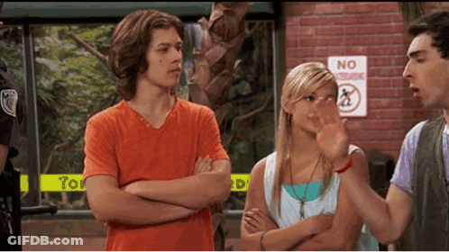 A Group Of People Standing In Front Of A Sign That Says No Standing GIF