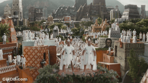 A Group Of People Standing In Front Of A Sign That Says ' Ox ' GIF