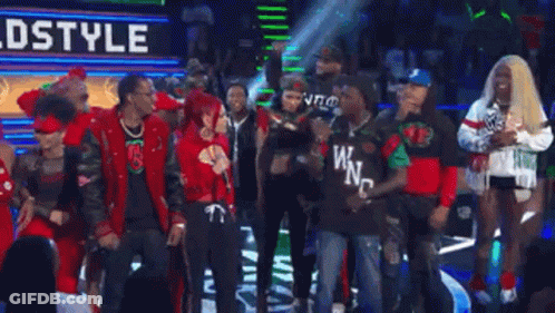 A Group Of People Standing In Front Of A Sign That Says Walkin ' Ahh ! GIF