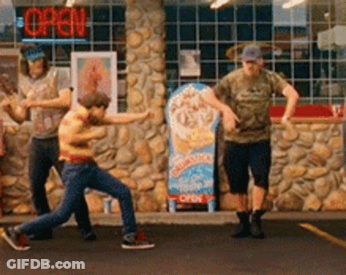 A Group Of People Standing In Front Of A Store With An Open Sign GIF