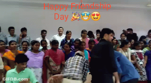 A Group Of People Standing In Front Of A Wall With The Words Happy Friendship Day Written Above Them GIF