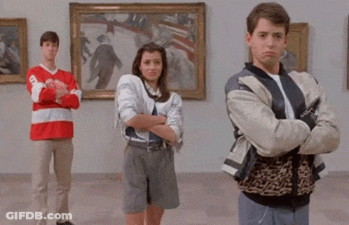 A Group Of People Standing In Front Of Paintings With The Words Deal With It In The Corner GIF