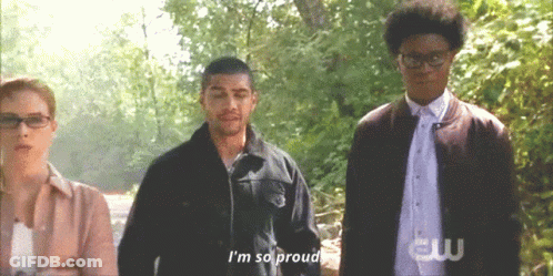 A Group Of People Standing Next To Each Other And One Of Them Says I 'M So Proud GIF