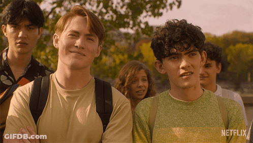 A Group Of People Standing Next To Each Other With A Netflix Logo On The Bottom GIF