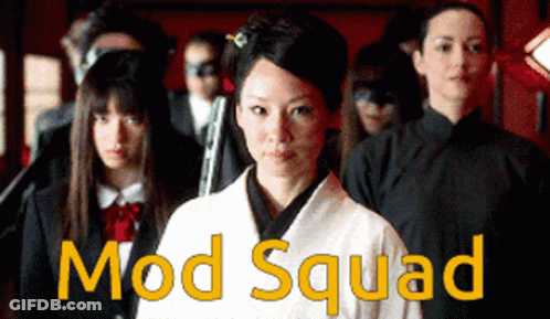 A Group Of People Standing Next To Each Other With Mod Squad Written On The Bottom Right GIF