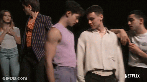 A Group Of People Standing Next To Each Other With Netflix Written On The Bottom Right GIF
