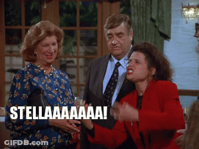 A Group Of People Standing Next To Each Other With One Woman Saying Stellaaaa ! GIF