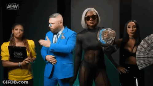 A Group Of People Standing Next To Each Other With The Aew Logo On The Bottom GIF