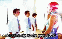 A Group Of People Standing Next To Each Other With The Words I Took A Trip To The Year 3000 GIF
