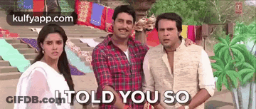 A Group Of People Standing Next To Each Other With The Words `` It Told You So '' Written On The Bottom . GIF